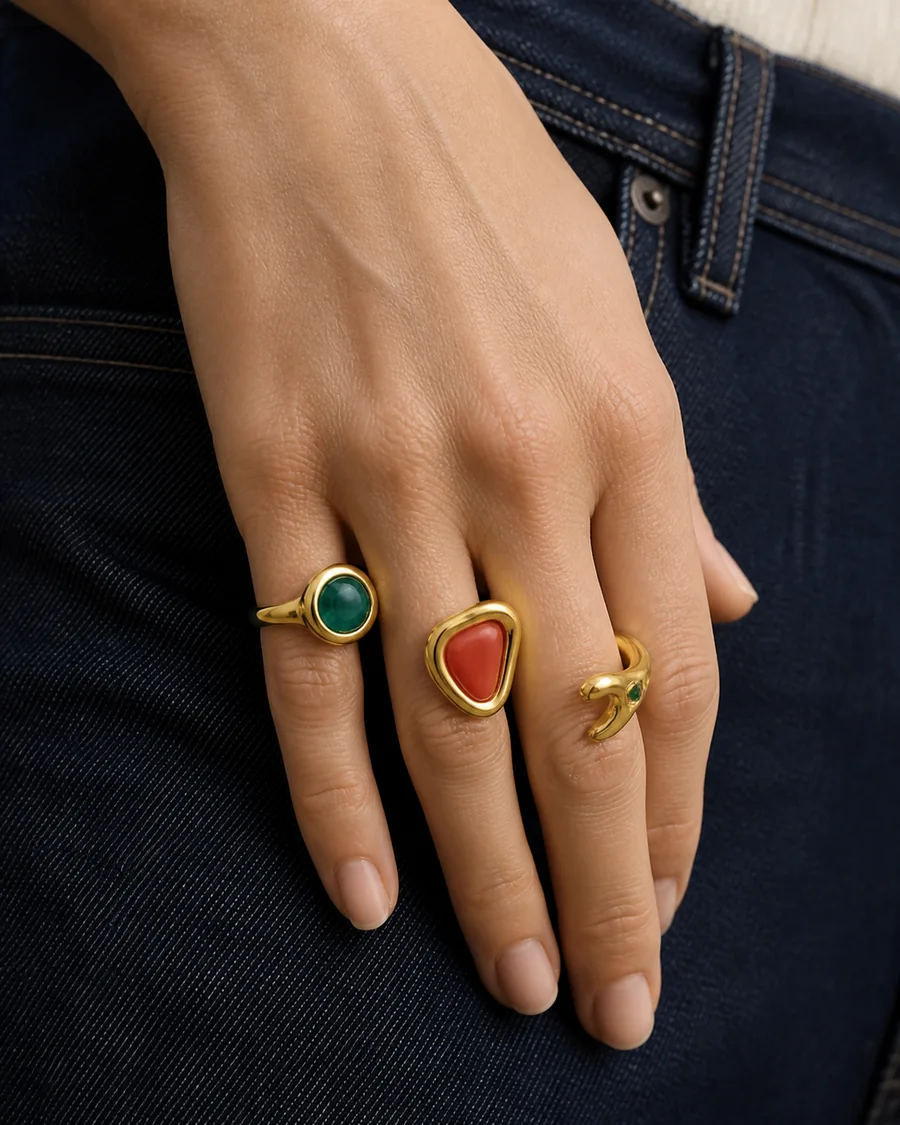 Sculptural rings styled with dark denim